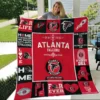 Atlanta Falcons Quilt Blanket on a bed